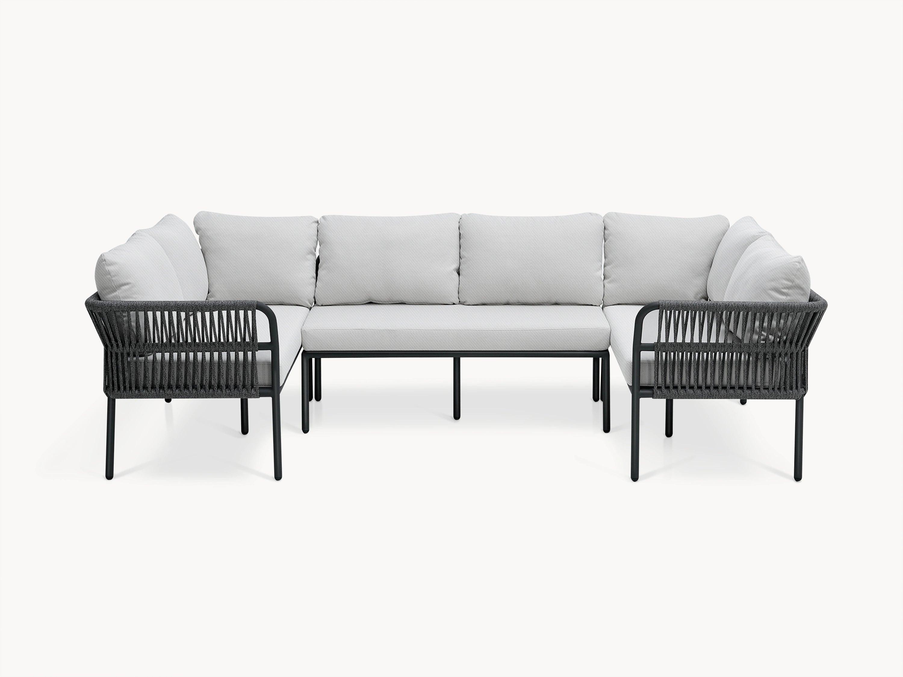Malaga Garten Ecklounge Set (6-Sitzer) mit weißem Sofa und zwei schwarzen Sesseln, robust und wetterfest, bietet flexibles, modulares Design für stilvolle Terrassengestaltung.