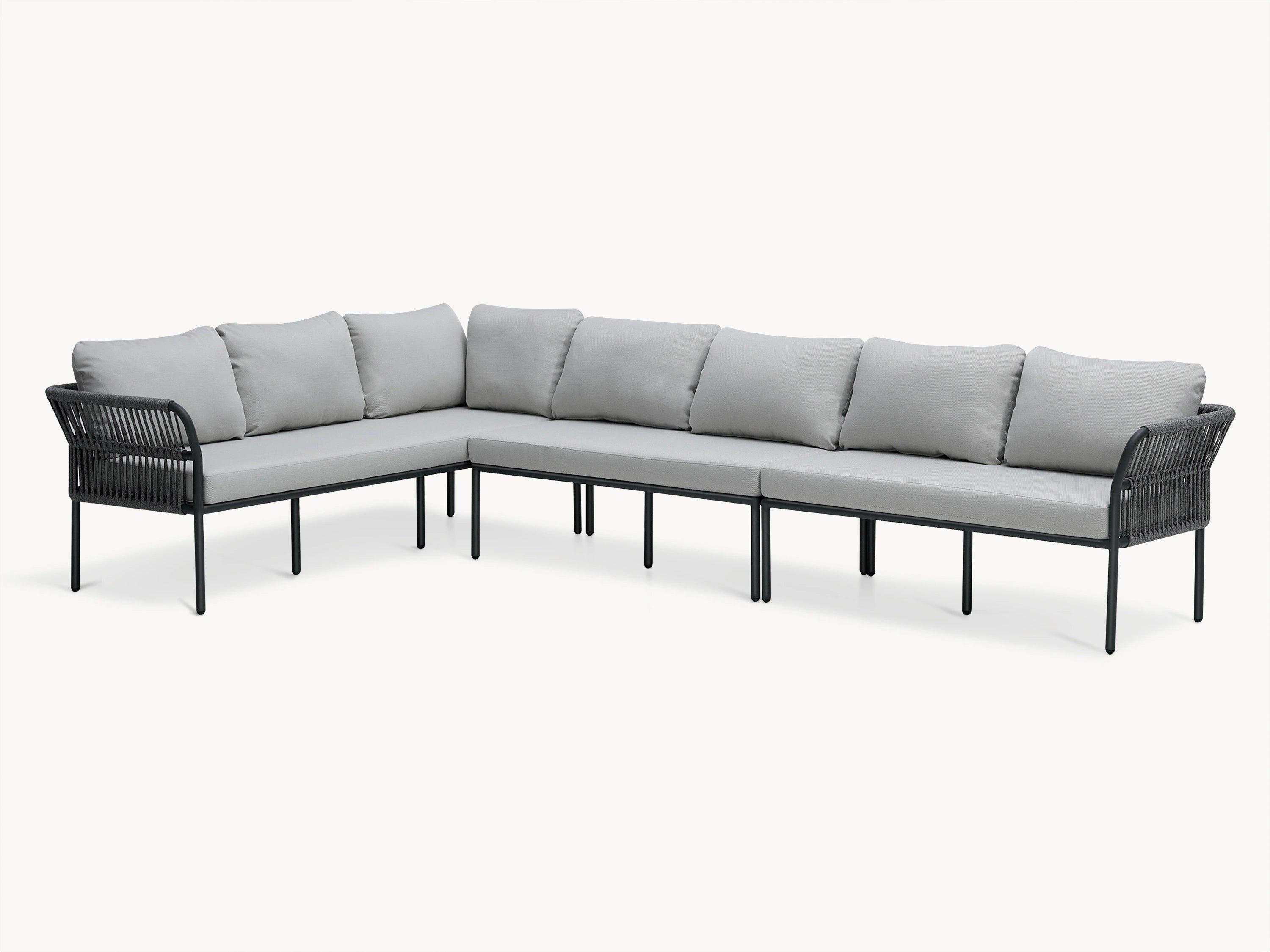 Malaga Garten Ecklounge Set (7-Sitzer) mit grauem Sofa und schwarzen Beinen, mehreren Kissen und pulverbeschichtetem Aluminiumrahmen, ideal für stilvolle und wetterfeste Terrassengestaltung.
